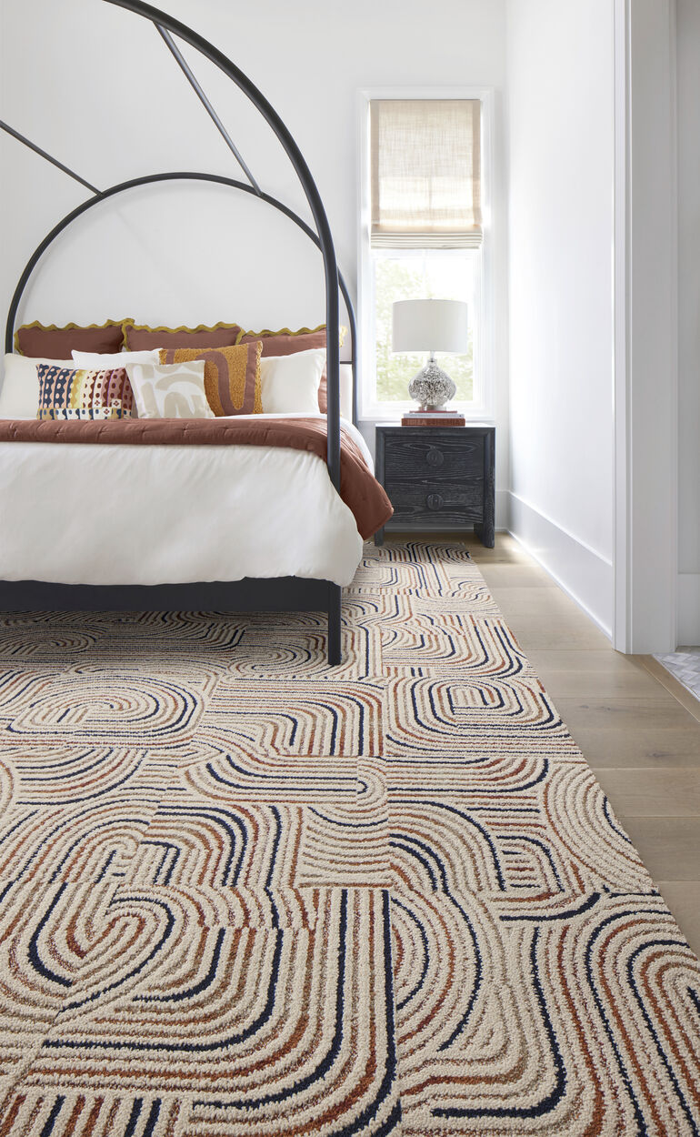 Bedroom with FLOR Leaps And Bounds rug shown in Saddle